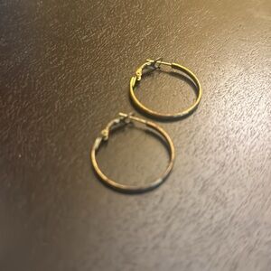 Bronze hammered hoop earrings 1.25 inches in diameter.
